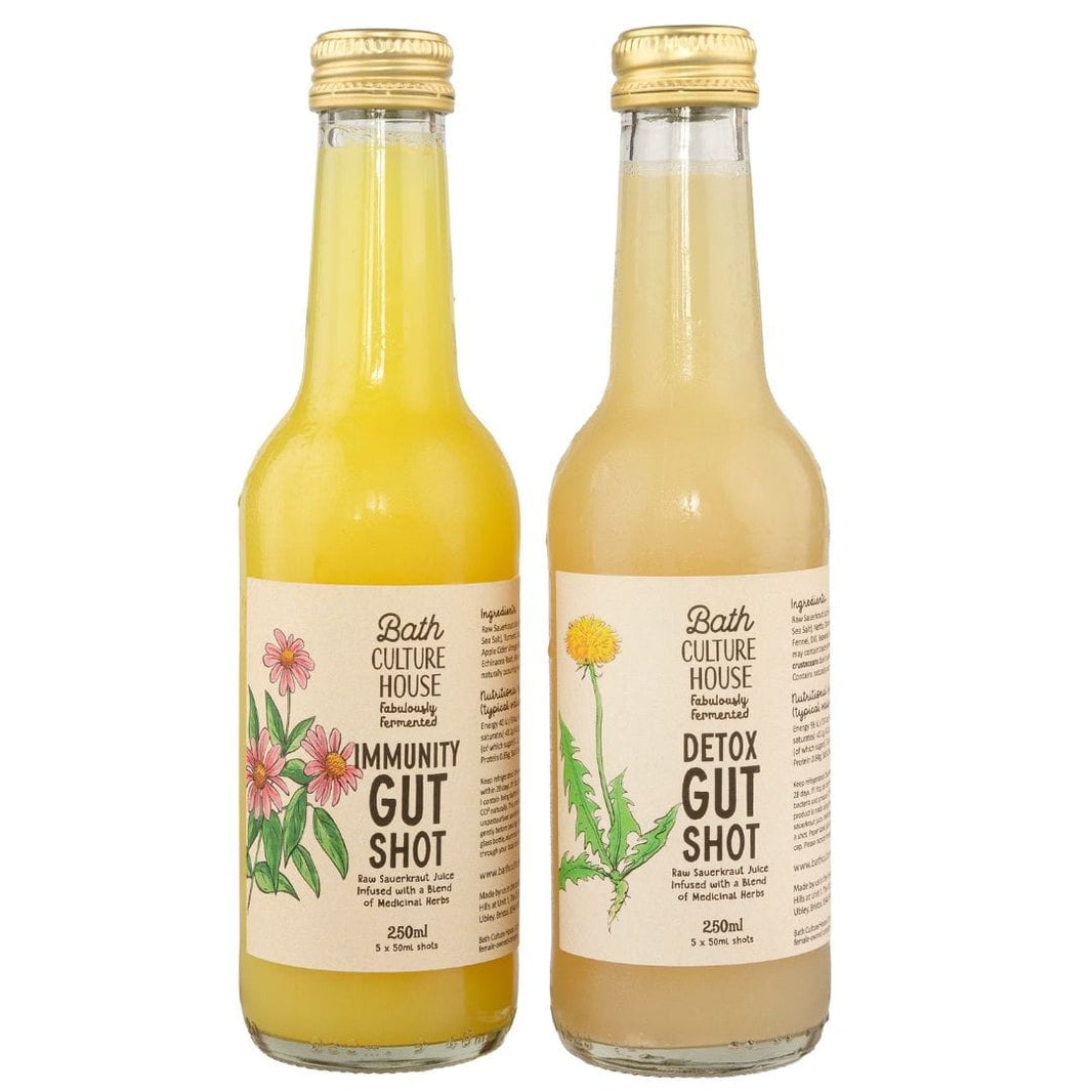 image Two glass bottles of 'Immunity Gut Shot' and 'Detox Gut Shot' from Bath Culture House on a white background.
