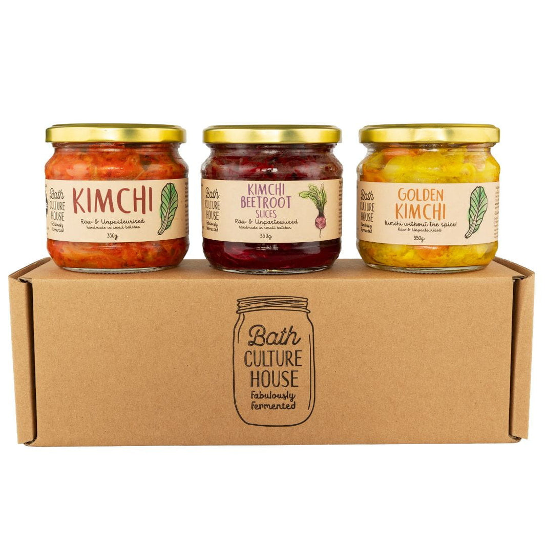 Three jars of kimchi and kimchi beetroot on a cardboard box with 'Bath Culture House' branding.