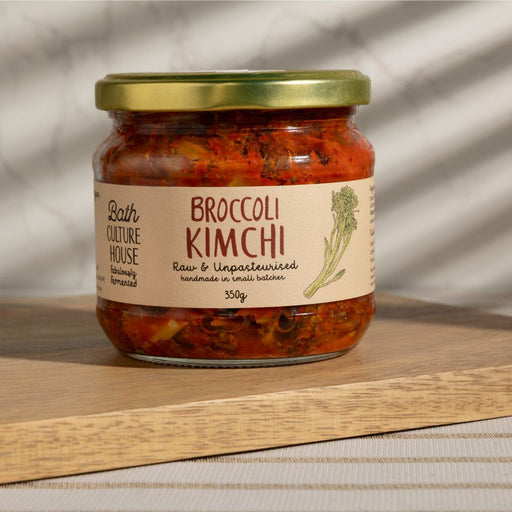 Jar of Broccoli Kimchi with a label on a wooden surface