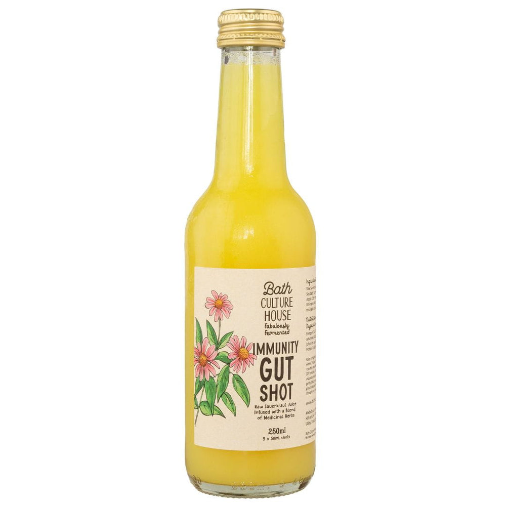 Bottle of 'Immunity Gut Shot' with a floral label on a white background by Bath Culture House