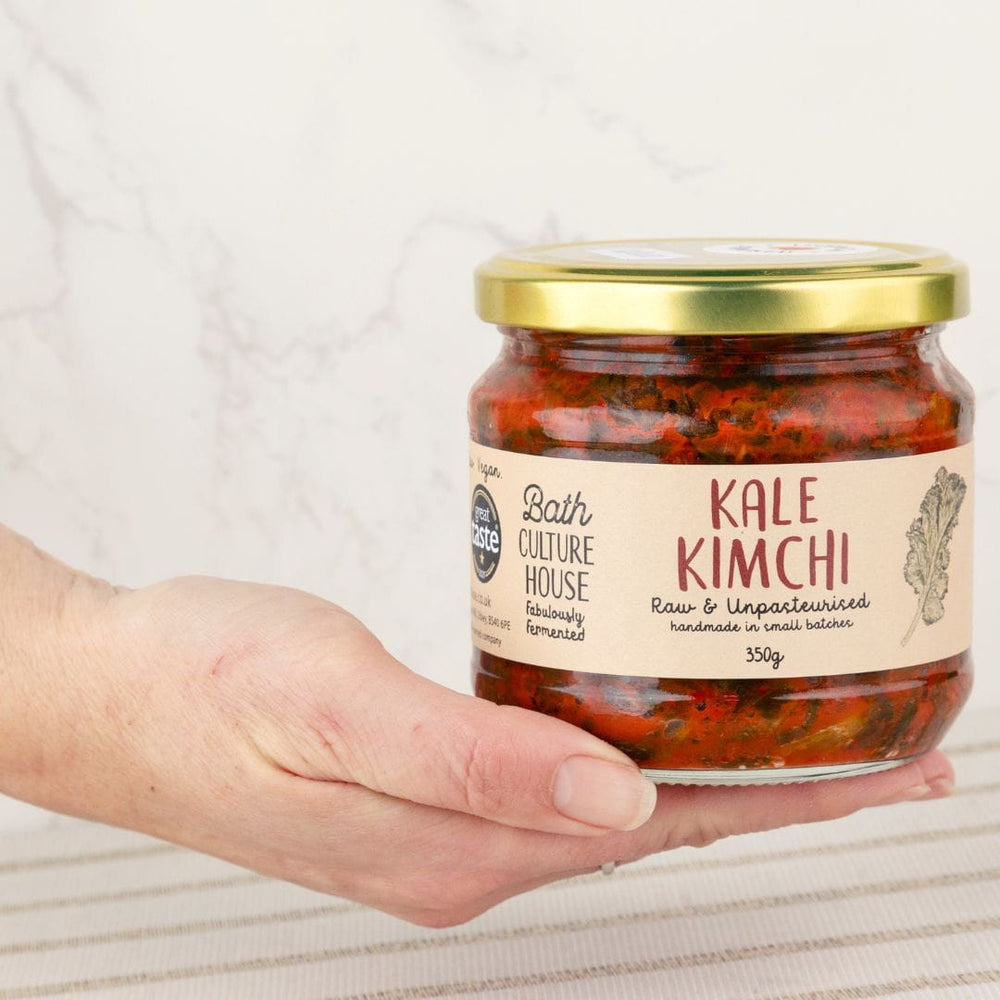 Person holding a jar of Kale Kimchi from Bath Culture House
