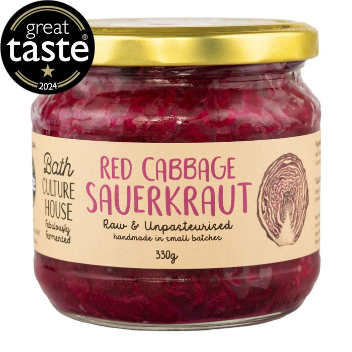 Jar of red cabbage sauerkraut with a gold lid and 'Great Taste' award logo on a white background.