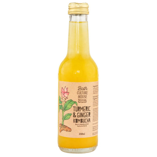 Bottle of Bath Culture House Turmeric & Ginger Kombucha on a white background